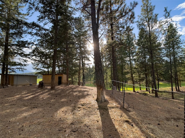 view of yard with an outdoor structure