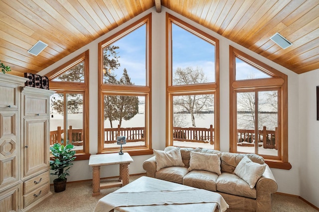 sunroom featuring vaulted ceiling and wooden ceiling