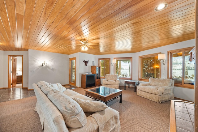 tiled living room with wooden ceiling, carpet flooring, and baseboards