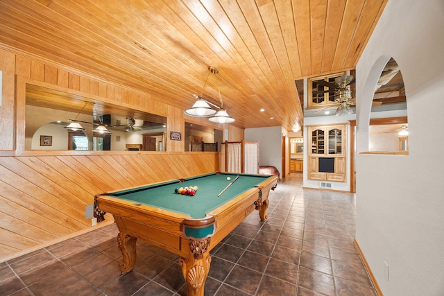 playroom with wooden ceiling, wooden walls, and visible vents