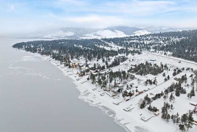 snowy aerial view with a mountain view