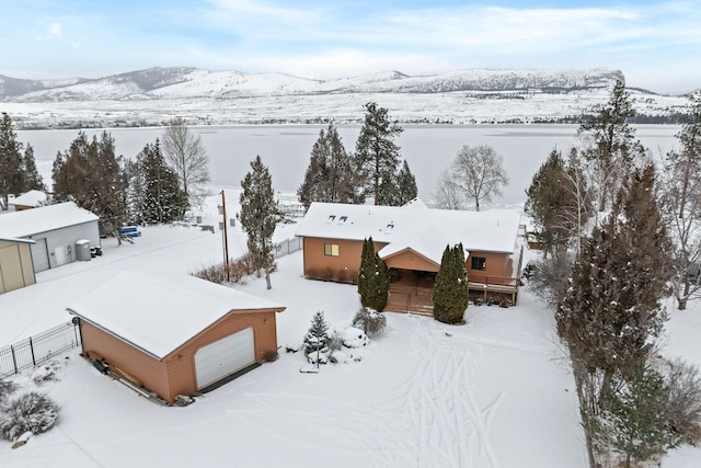 snowy aerial view featuring a mountain view