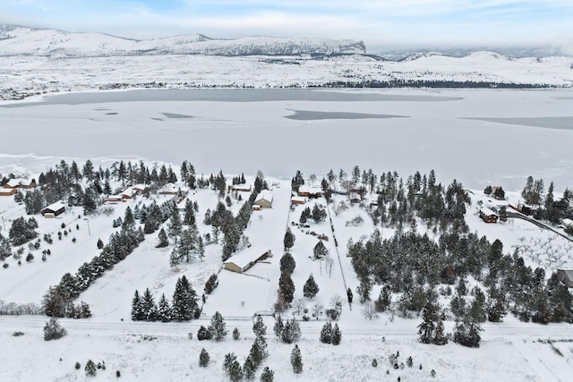 snowy aerial view with a mountain view