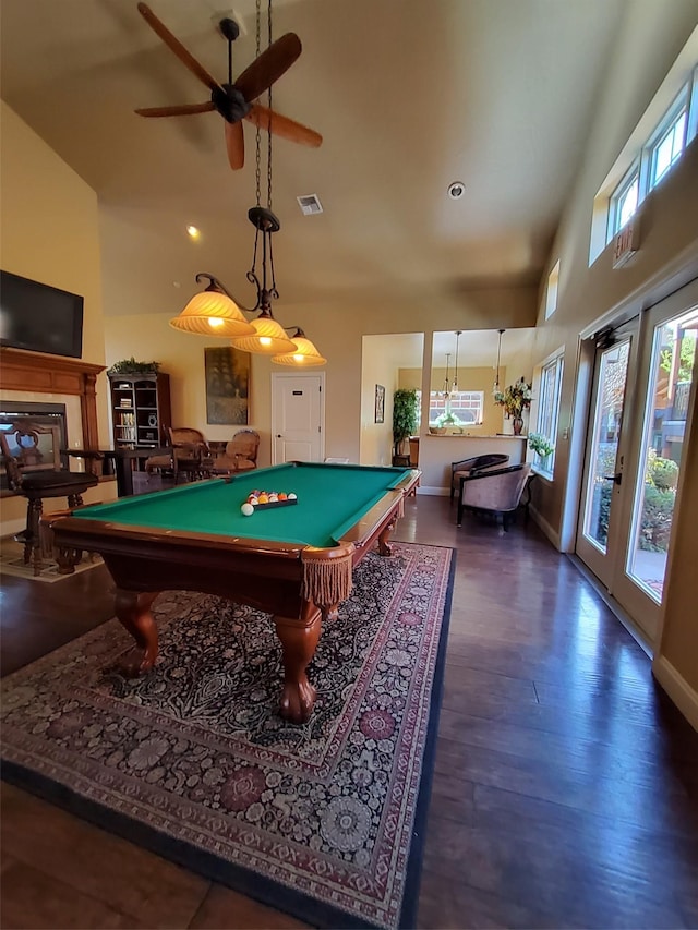 game room with billiards, a high ceiling, visible vents, and wood finished floors