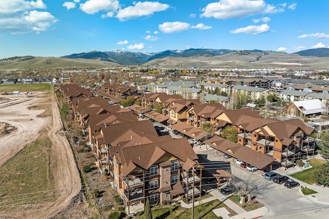 birds eye view of property with a mountain view and a residential view