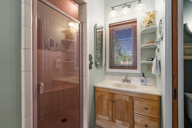 full bath with toilet, a stall shower, and vanity