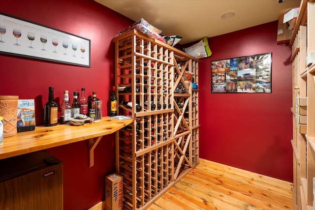 wine area with wood finished floors