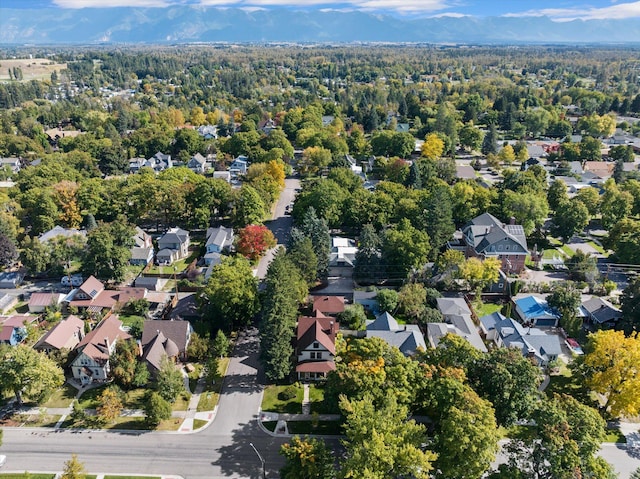 drone / aerial view featuring a residential view and a mountain view