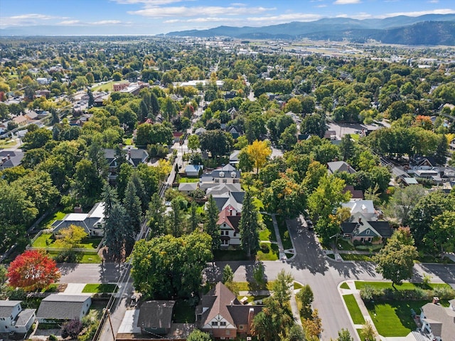 drone / aerial view featuring a residential view and a mountain view