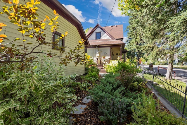 view of side of property with fence