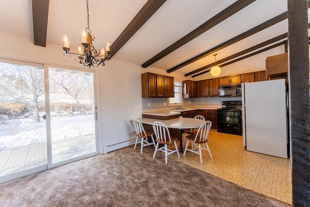 kitchen with a baseboard radiator, a peninsula, light countertops, black appliances, and a sink