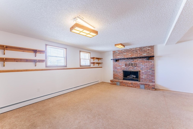 unfurnished living room with carpet, a baseboard radiator, a fireplace, and a textured ceiling