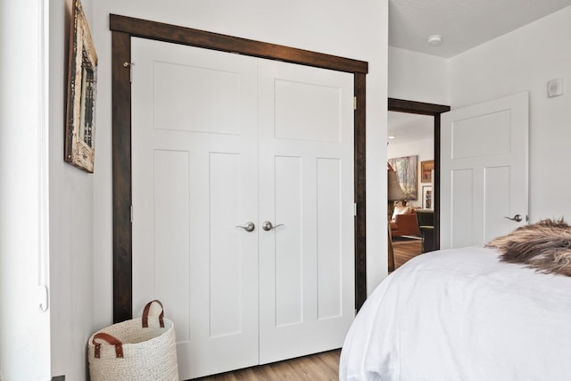 bedroom with a closet and wood finished floors