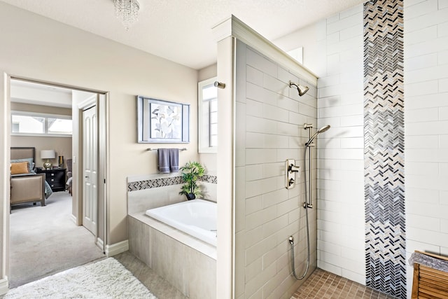 full bath with plenty of natural light, a tile shower, a textured ceiling, and a bath