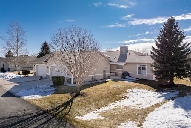 ranch-style home featuring concrete driveway, a chimney, an attached garage, and stucco siding