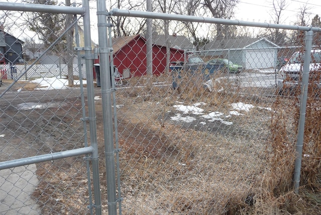 view of yard with fence and a gate