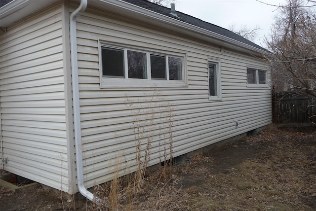 view of property exterior featuring fence