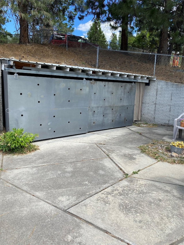 garage with fence