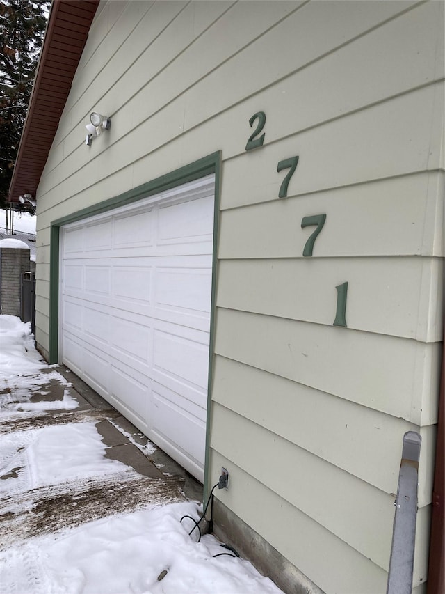 view of snow covered garage