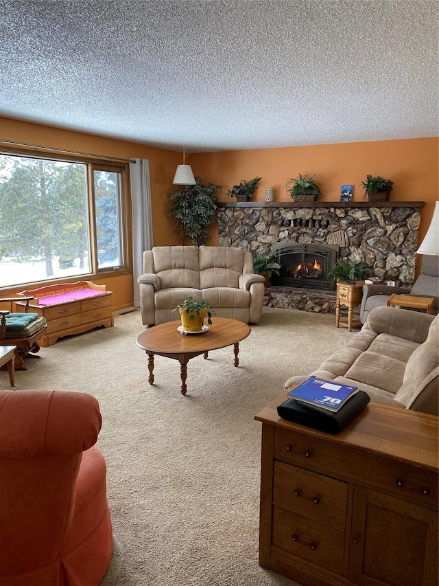 carpeted living area with a fireplace and a textured ceiling