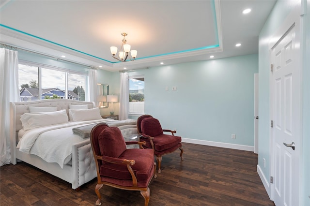 bedroom featuring dark wood-type flooring, a tray ceiling, baseboards, and recessed lighting