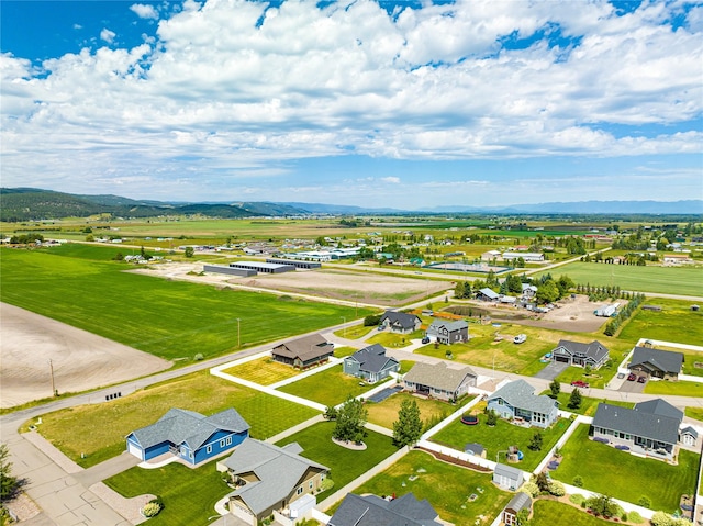 drone / aerial view with a residential view and a mountain view