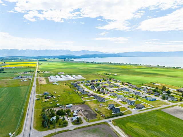 birds eye view of property featuring a water and mountain view