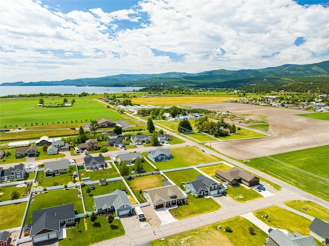 bird's eye view with a residential view and a water and mountain view