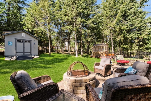 156 Wulff Ln, Lakeside, MT 59922 - view of patio / terrace featuring a fire pit and view of wooded area
