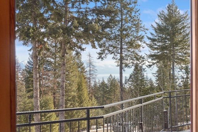 156 Wulff Ln, Lakeside, MT 59922 - balcony featuring a wooded view
