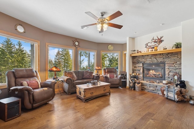 156 Wulff Ln, Lakeside, MT 59922 - living room featuring light wood-style flooring, a ceiling fan, and a fireplace