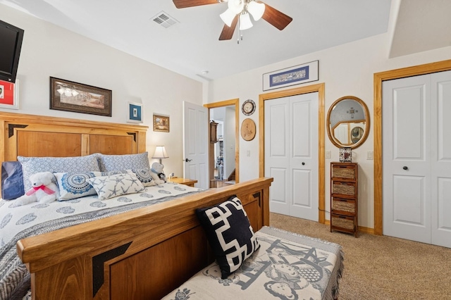 156 Wulff Ln, Lakeside, MT 59922 - bedroom with light colored carpet, multiple closets, and ceiling fan