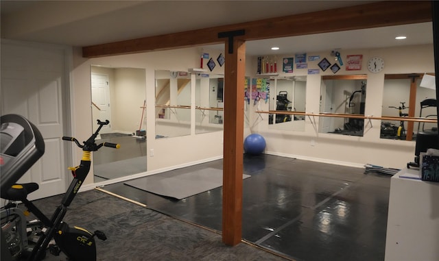 exercise area with baseboards and recessed lighting