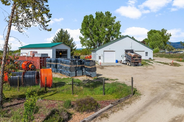245 Olde Rd, Hamilton, MT 59840 - view of yard featuring a garage and an outbuilding