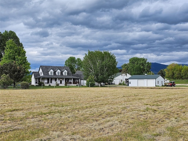 view of yard featuring a garage and an outdoor structure