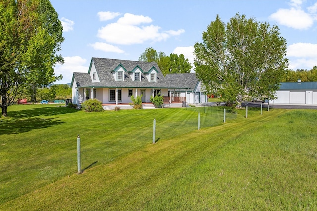 245 Olde Rd, Hamilton, MT 59840 - cape cod home featuring a porch and a front yard