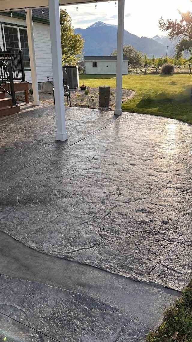 view of patio / terrace with a mountain view