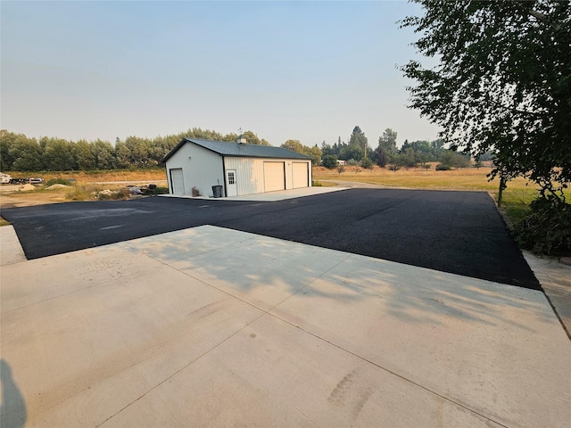 exterior space with a garage and an outdoor structure