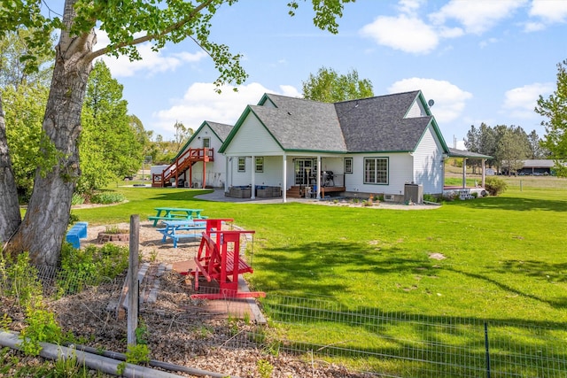 245 Olde Rd, Hamilton, MT 59840 - back of house featuring a patio area, roof with shingles, central air condition unit, stairway, and an outdoor fire pit