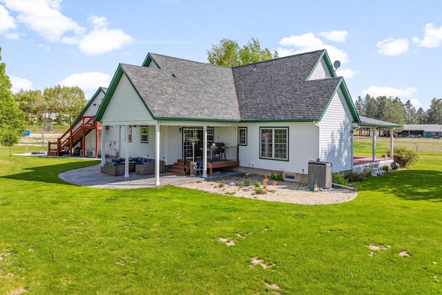 245 Olde Rd, Hamilton, MT 59840 - rear view of house with a patio, a lawn, an outdoor hangout area, and central AC unit