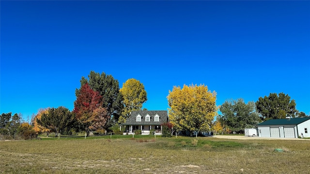 245 Olde Rd, Hamilton, MT 59840 - view of grassy yard featuring a garage
