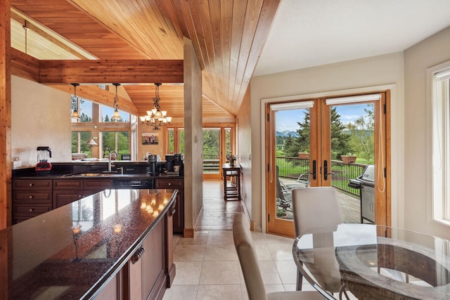 99 Golf Ter, Bigfork, MT 59911 - kitchen featuring a sink, french doors, a chandelier, pendant lighting, and light tile patterned floors
