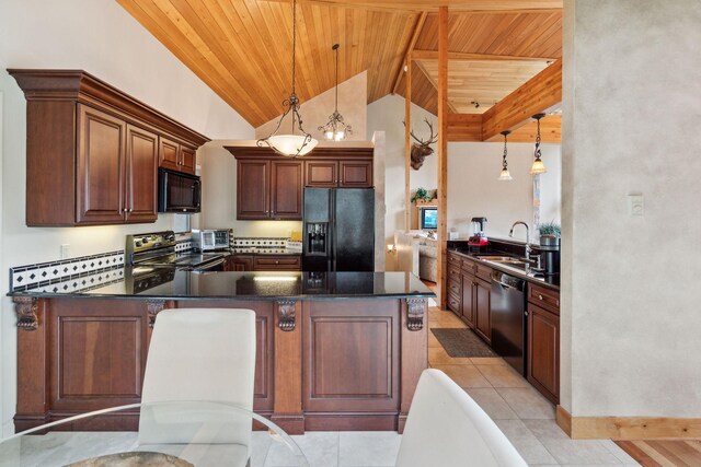 99 Golf Ter, Bigfork, MT 59911 - kitchen featuring black appliances, wood ceiling, a sink, lofted ceiling, and a peninsula