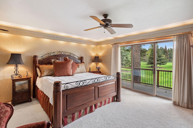 99 Golf Ter, Bigfork, MT 59911 - bedroom featuring light carpet, access to exterior, a ceiling fan, and ornamental molding