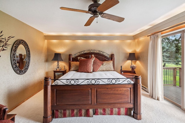 99 Golf Ter, Bigfork, MT 59911 - bedroom with carpet flooring, access to outside, a baseboard radiator, ceiling fan, and a textured wall