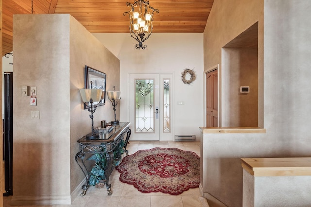 99 Golf Ter, Bigfork, MT 59911 - entrance foyer featuring wood ceiling, light tile patterned floors, and high vaulted ceiling