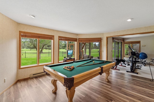 99 Golf Ter, Bigfork, MT 59911 - game room with a baseboard radiator, billiards table, light wood-style floors, baseboards, and plenty of natural light