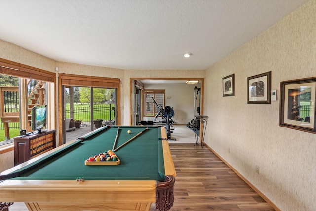 99 Golf Ter, Bigfork, MT 59911 - game room with wallpapered walls, pool table, wood finished floors, baseboards, and a textured ceiling