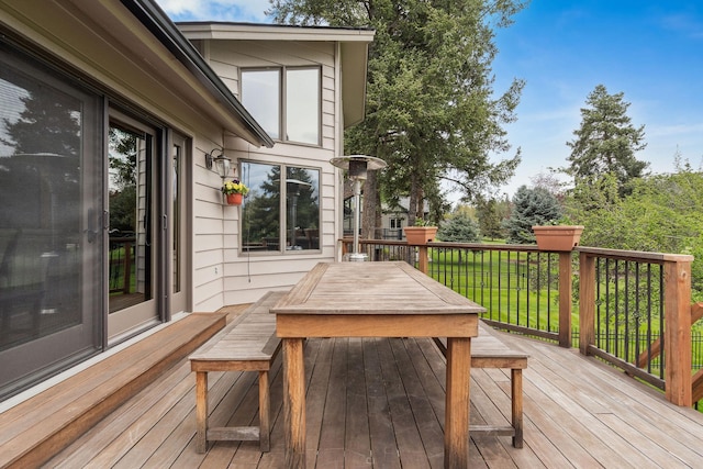 99 Golf Ter, Bigfork, MT 59911 - wooden terrace featuring outdoor dining space