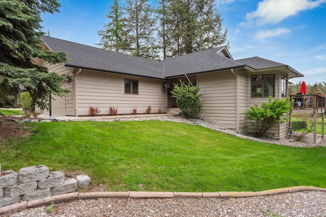 99 Golf Ter, Bigfork, MT 59911 - rear view of house with a yard and roof with shingles